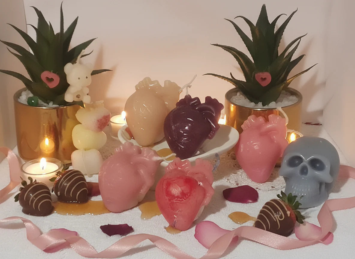 Heart candles close-up of details and definition served with chocolates on heart holder presentation